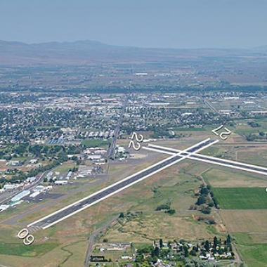 Yakima Airport runway located in flat grasslands near the city center.